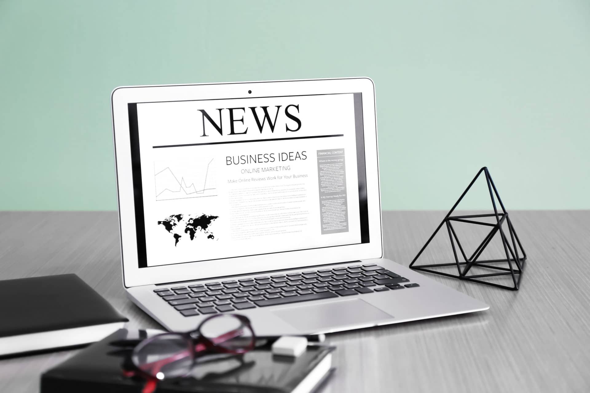 Workplace with laptop and news on screen Testimonial 2